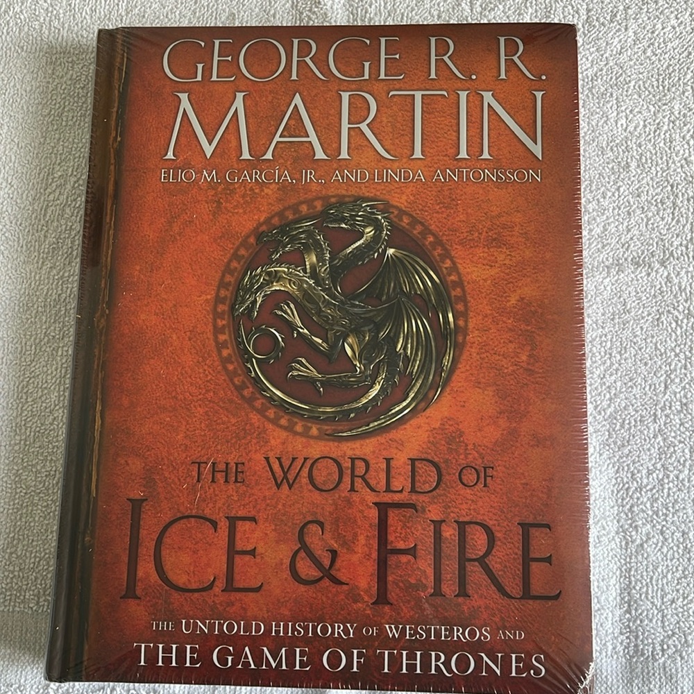 George RR Martin The World of Ice & Fire, hard back. Brand new, in shrink wrap!